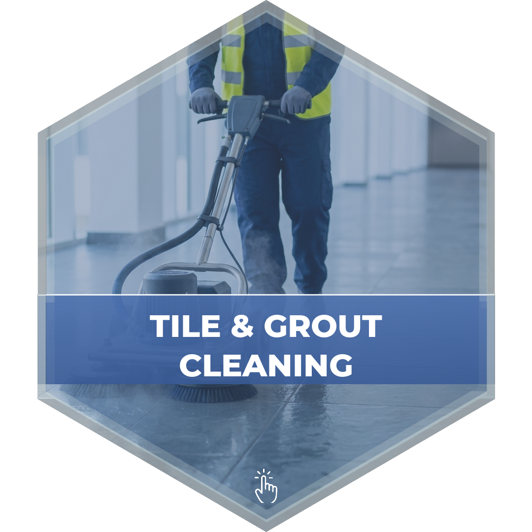 Technician operating a tile and grout cleaning machine on a commercial floor - Modular Concepts