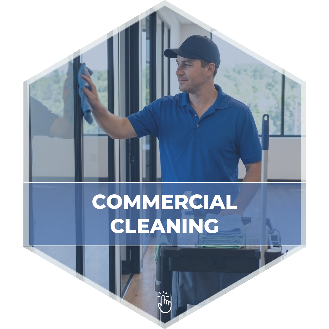 Modular Concepts commercial cleaning technician wiping down glass office partitions beside a supply cart in a modern Massachusetts commercial building