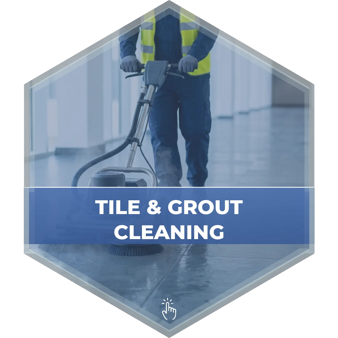 Technician operating a tile and grout cleaning machine on a commercial floor - Modular Concepts