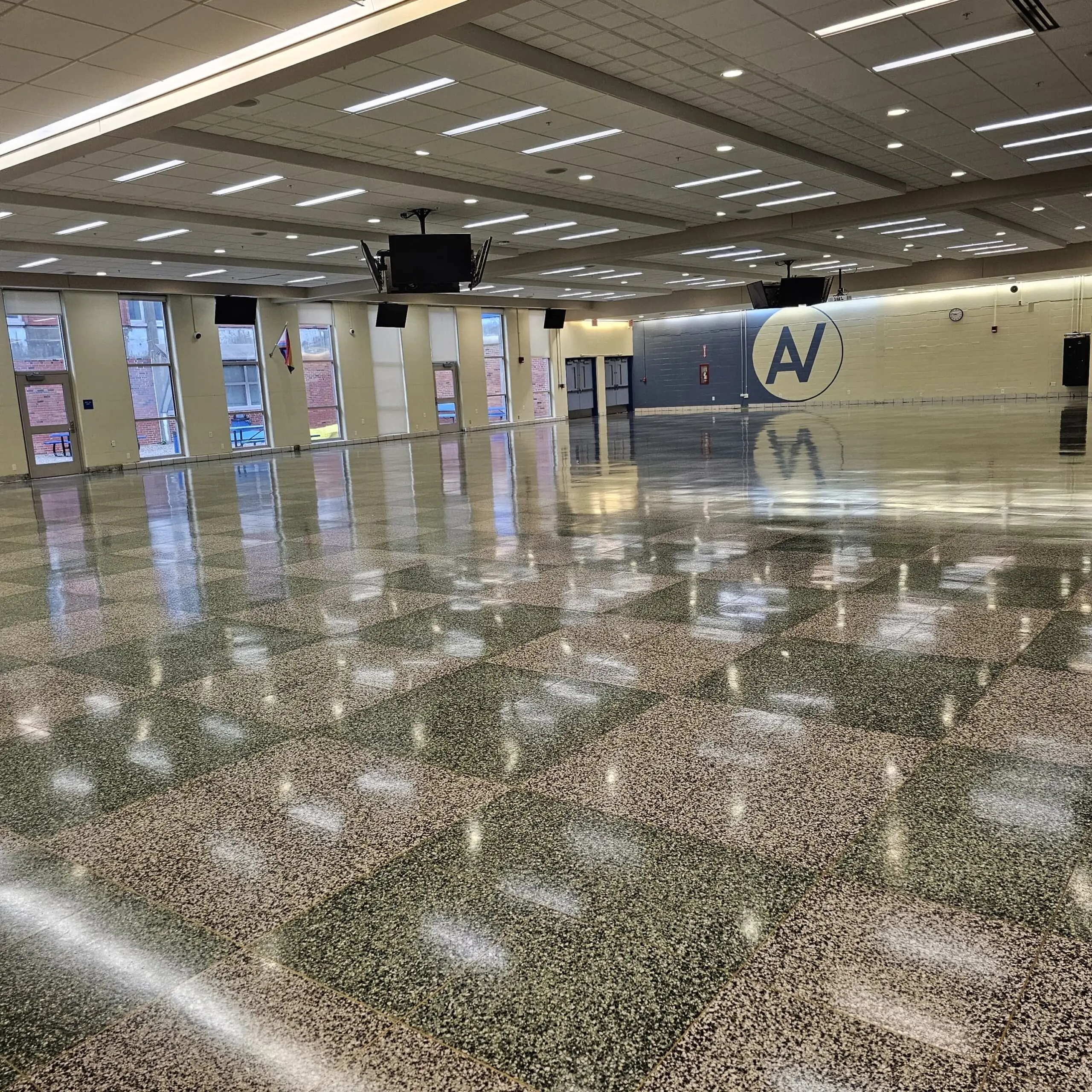 Empty terrazzo cafeteria during the summer floor refinishing window