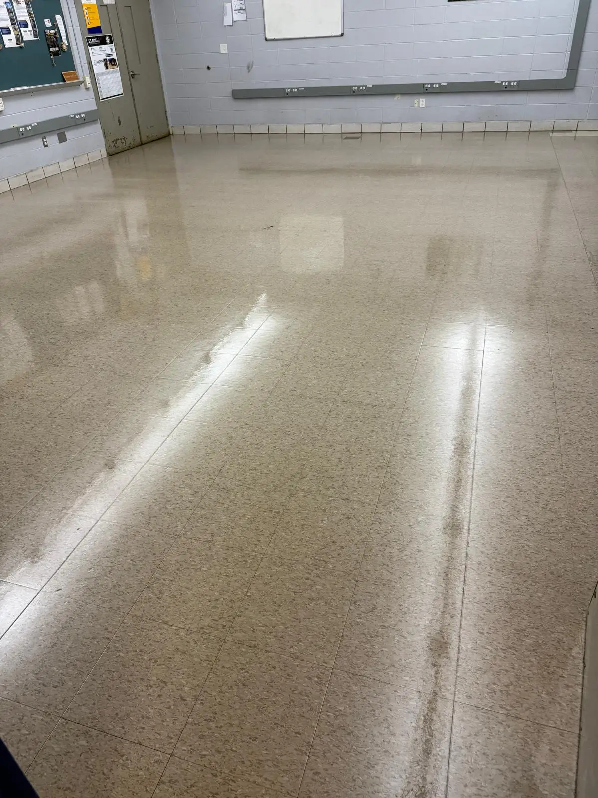 Same classroom floor after strip and wax refinishing with a high gloss finish