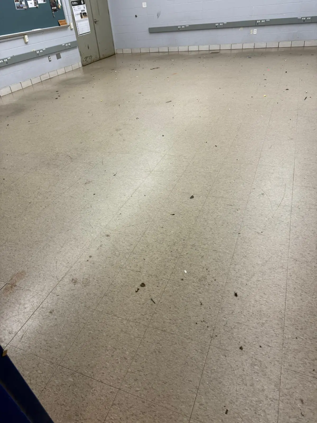 Worn classroom VCT floor before refinishing at a MetroWest Massachusetts school
